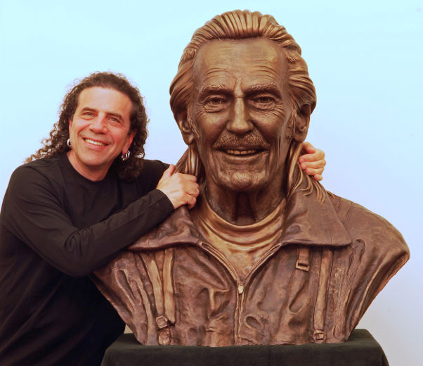 Sculptor Gino Cavicchioli with the bust of Gordon Lightfoot he created.